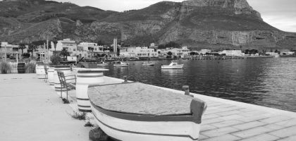 Monochrome view of a serene coastal town in Sicilia, Italy.