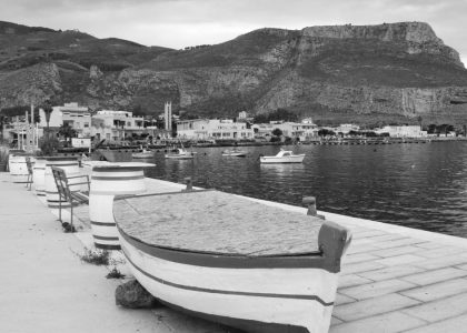 Monochrome view of a serene coastal town in Sicilia, Italy.